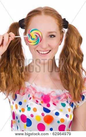 Redhead young girl with lolipops isolated on white