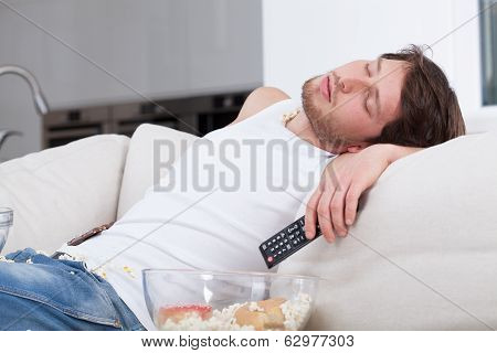 Tired Man Sleeping On Couch