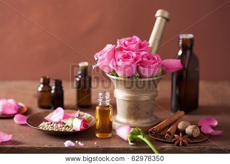 spa and aromatherapy set with rose flowers mortar and spices 
