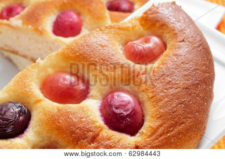 closeup of some pieces of coca amb cireres, typical cake of Catalonia, Spain, with cherries