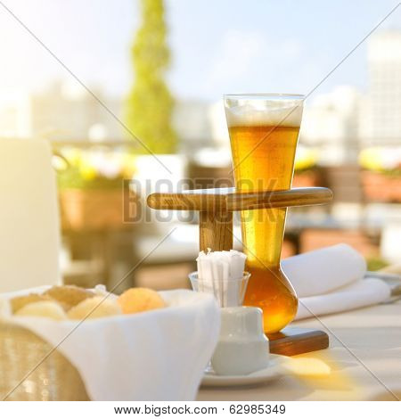 Kwak beer on the served table. Outdoors photo.