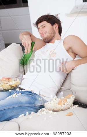 Lazy Man Sitting On Couch