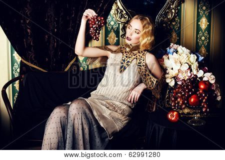 Beautiful fashion model in a rich historical dress. Vintage. Luxury style. 