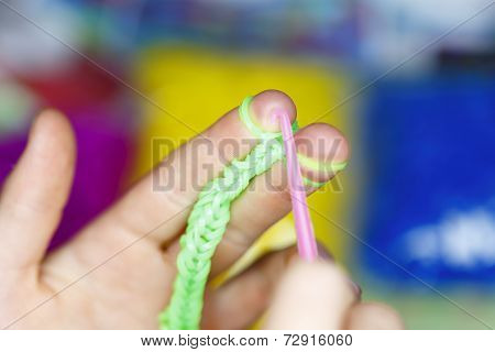 Child Is Playing With Loom