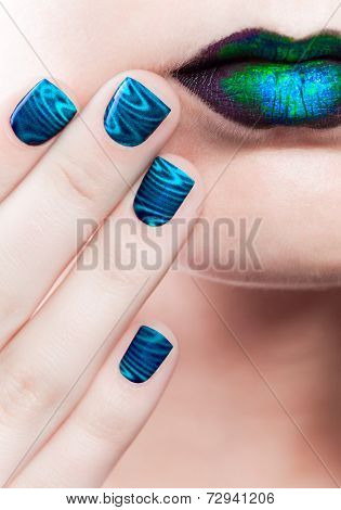 Woman's Lips With Beautiful Multicolor Minx Nails And Make-up
