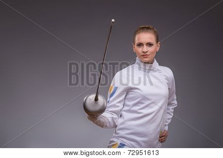 Young woman engaging in fencing