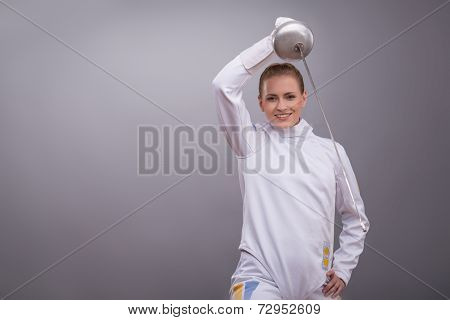 Young woman engaging in fencing