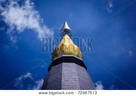 Blue sunny sky with thai pagoda in front