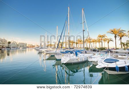 Scenic view of some Yachts in Marina port at dusk in Benalmadena Malaga Spain on April 29 2014.