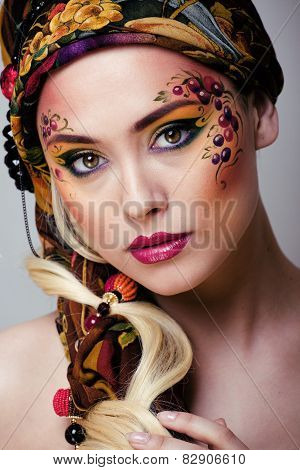 portrait of contemporary noblewoman with face art creative close