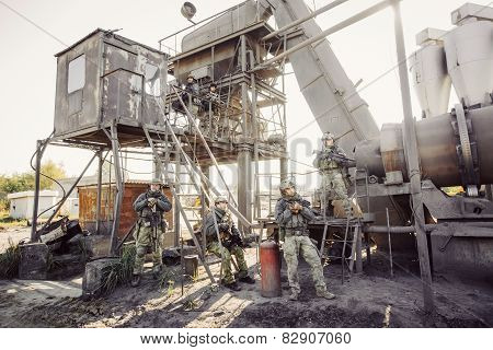 Group Of Soldiers Guarding The Plant