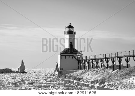 Contemplative man at winter lighthouse