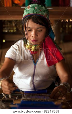 Portrait Of Kayan Lahwi Girl Is Weaving.