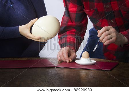 Woman Gives Ostrich Egg To Man