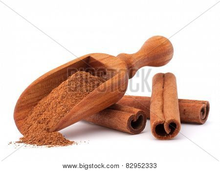 ground cinnamon spice powder in wooden spoon isolated on white background cutout