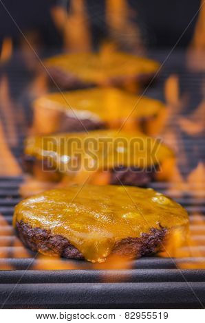 Cheeseburgers on a Hot Flaming Grill