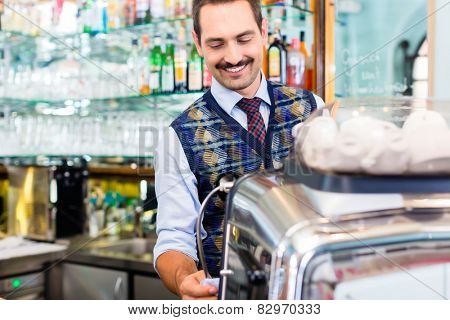 Barista preparing coffee in cafe bar using professional espresso machine