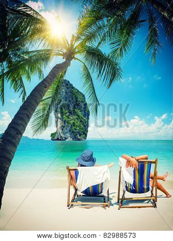 Couple of tourists on the beach in Thailand