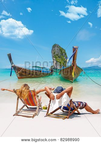Couple of tourists on the beach in Thailand