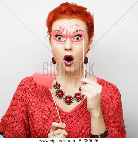 Attractive playful young woman ready for party - falce lips and glasses  