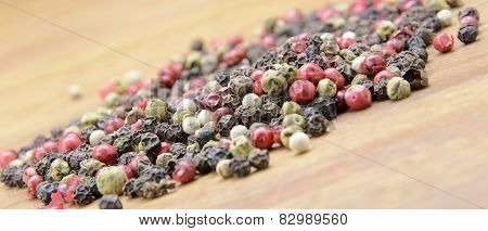 pepper sprinkled on raw wood.