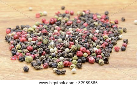 pepper sprinkled on raw wood.