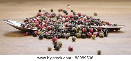 pepper sprinkled on raw wood.