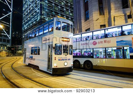HONG KONG - JUNE 03, 2015: double-decker tram on street of HK. Hong Kong Tramways is a tram system in Hong Kong, being one of the earliest forms of public transport in the metropolis.