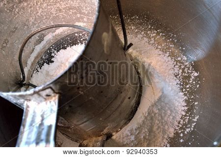 Hand Sifter And Powdered Sugar Background