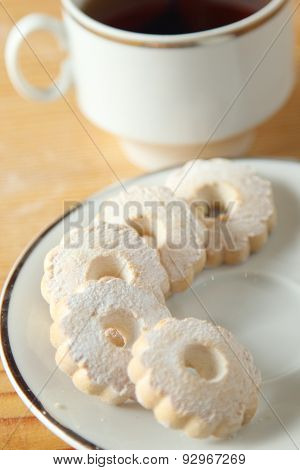 Italian Canestrelli Biscuits On The Saucer Near A Cup Of Black Tea