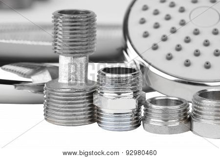Plumbing fitting and showerhead