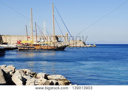 sailboat on the dock at the castle in Rhodes