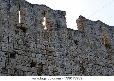 top medieval fortress wall in the city park in Rhodes
