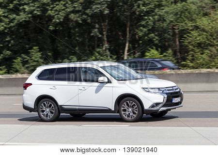 FRANKFURT GERMANY - JULY 12 2016: Third generation Mitsubishi Outlander on the highway in Germany