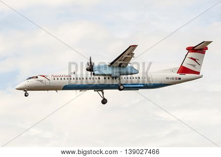 FRANKFURT GERMANY - JULY 12 2016: Austrian Airlines Bombardier Dash 8 landing at the Frankfurt Main international airport