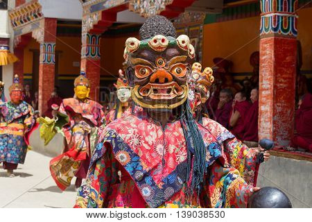 LAMAYURU INDIA - JUNE 13 2015: Unidentified buddhist lamas dressed in mystical mask dancing Tsam mystery dance in time of Yuru Kabgyat Buddhist festival at Lamayuru Gompa Ladakh North India