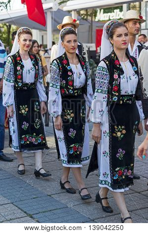 ROMANIA TIMISOARA - JULY 7 2016: Young Romanian dancers in traditional costume present at the international folk festival "International Festival of hearts" organized by the City Hall Timisoara.