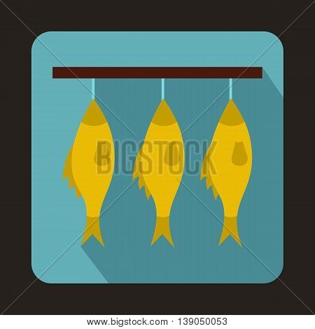 Three dried fish hanging on a rope icon in flat style on a baby blue background