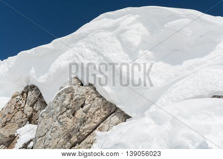 Detail of a shrouded snow mountain peak of the Alps