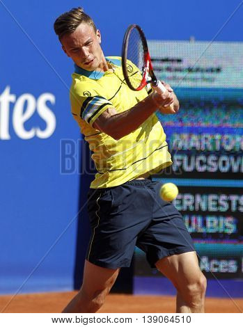 BARCELONA - APRIL,19: Hungarian tennis player Marton Fucsovics in action during a match of Barcelona tennis tournament Conde de Godo on April 19, 2016 in Barcelona