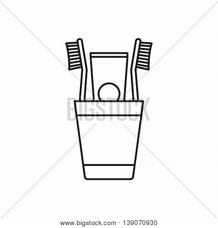 Plastic cup with brushes icon in outline style isolated vector illustration