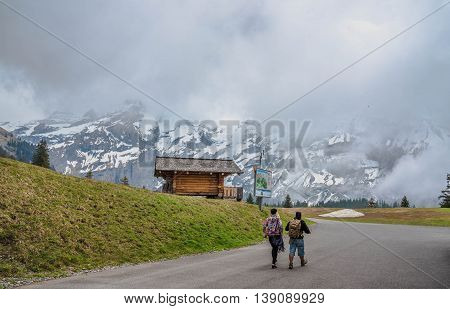 A Couple Walking to Oeschinensee Lake - Kandersteg Switzerland
