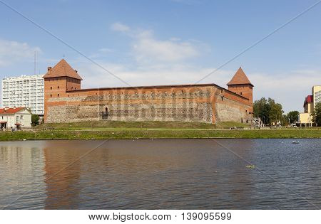 Lida Castle with the castle lake. Lida. Belarus.