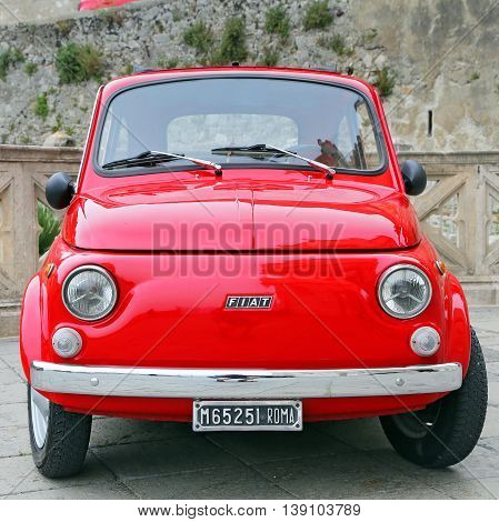 GAETA ITALY - JUNE 25 2016: Fiat 500 on the street in the center of Gaeta. Fiat 500 was produced by the Fiat company from 1957 to 75. New version of the car started production in 2007 Gaeta