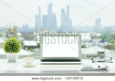 White Laptop On Windowsill