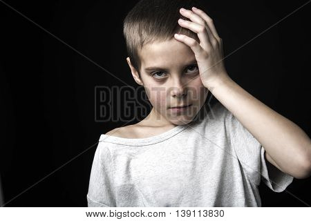 A stressed sad boy on studio bad time