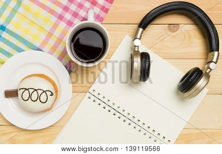 Music and Writing relaxation in Cafe with copy space notebook