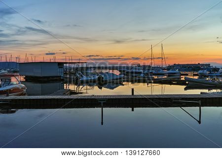 Sunset seascape with small boats at the port of Sozopol, Burgas Region, Bulgaria