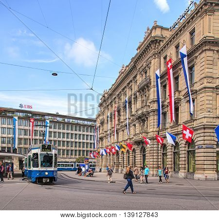 Zurich, Switzerland - 1 August, 2014: view on Paradeplatz square from Bahnhofstrasse street. Zurich is the largest city in Switzerland and the capital of the Swiss canton of Zurich.