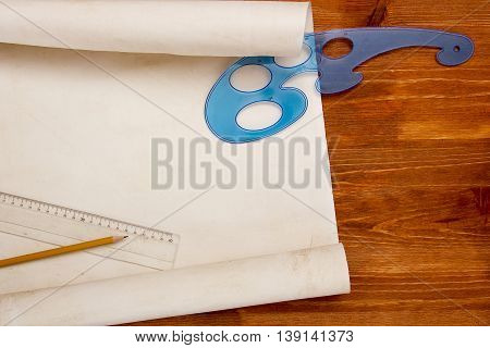 Roll of paper for drawings on a wooden table